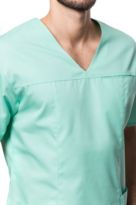 Bluza medyczna męska Robert – wkładana przez głowę, z dekoltem w serek, trzema kieszeniami i rozcięciami w bocznych szwach.
